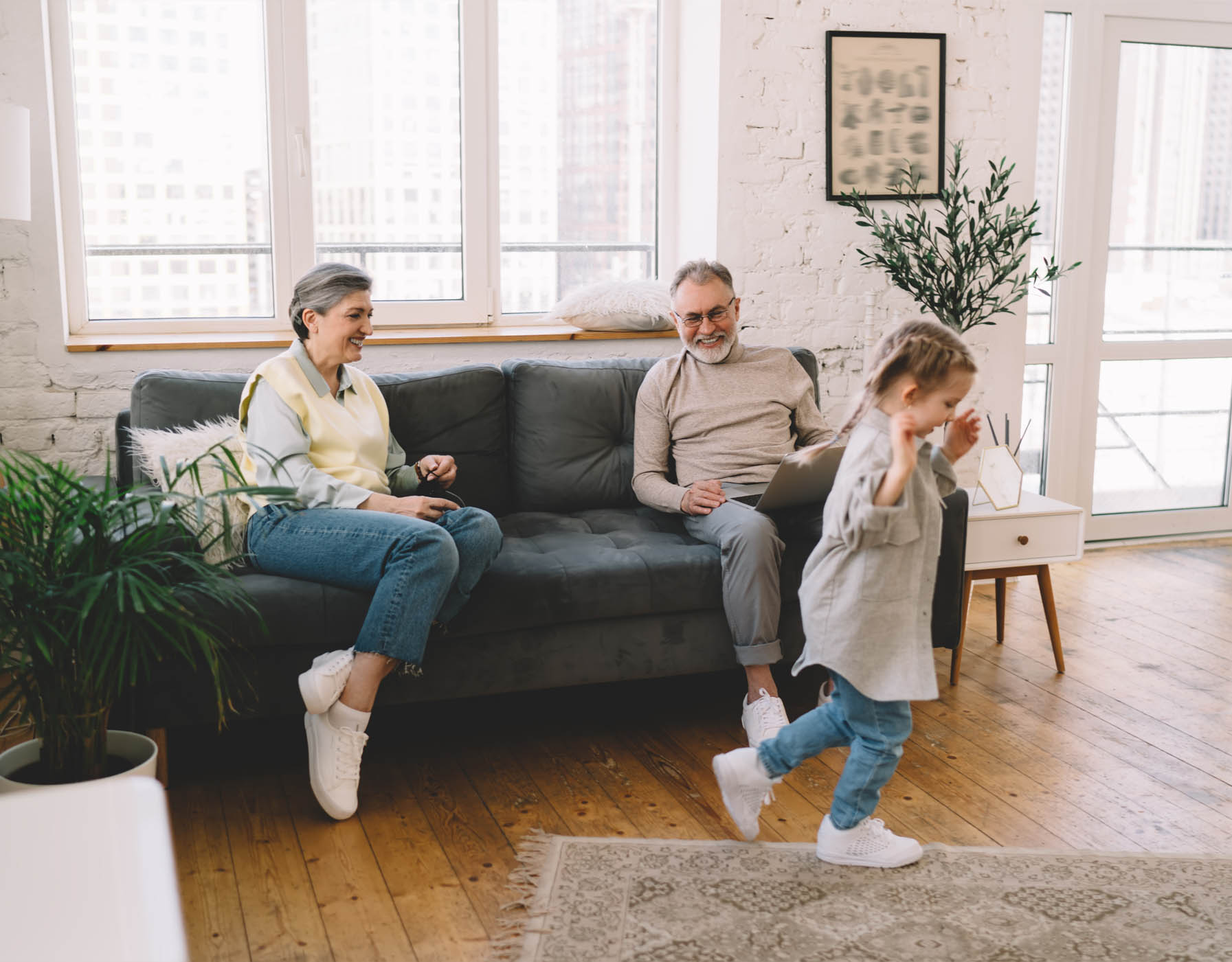 A family revisiting old photos at home